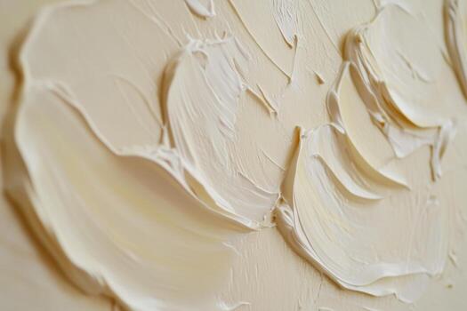 Textured abstract artwork showcasing layers of cream-colored paint in close-up photo