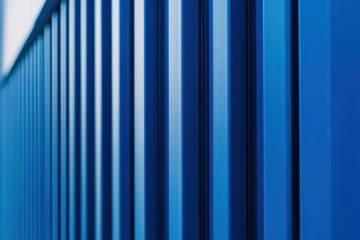 Detailed view of a blue textured surface with vertical patterns in daylight photo