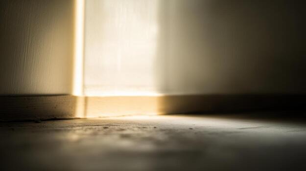 Light streaming through a crack in the door creating a warm glow on the floor photo