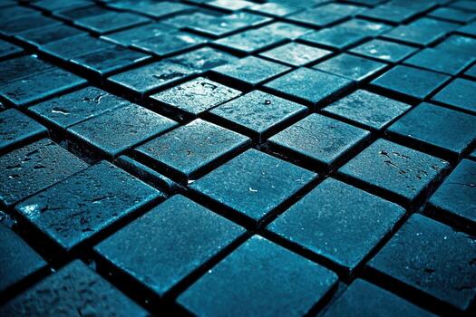 Close view of dark blue tiles arranged in a unique pattern on a surface photo