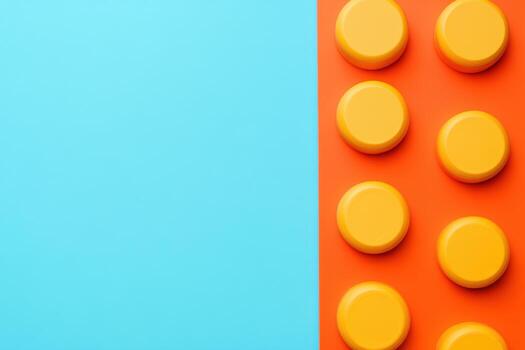 Bright yellow circular building blocks against a vibrant background photo