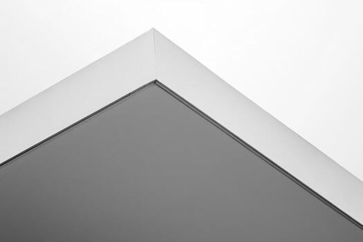 Modern architectural design showcasing a minimalistic roof edge in grayscale photo