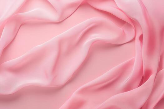 Soft pink fabric draping elegantly on a light background for design use photo