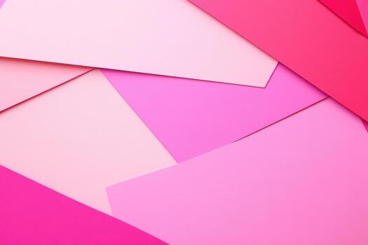 Colorful layers of pink paper create an artistic flat lay composition photo