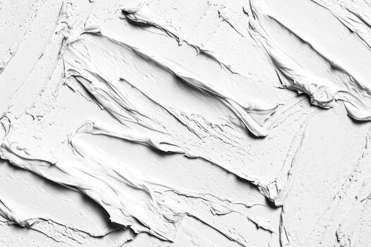 Thick white paint texture being applied on canvas with a palette knife photo