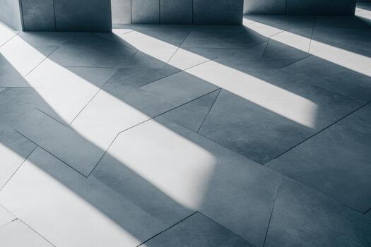 Shadows cast by modern architecture on textured flooring at midday photo