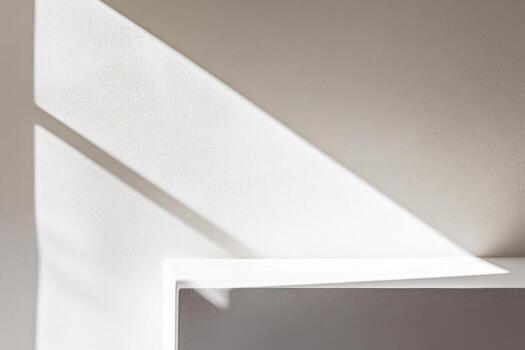 Light and shadow interplay on a textured wall in a modern interior space photo
