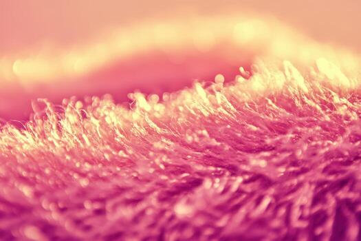 Close-up view of fluffy texture shining under soft pink light photo