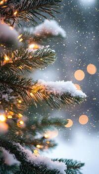 Close-up of snow-covered Christmas tree branches with warm fairy lights and festive bokeh background photo