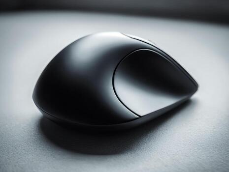 Sleek ergonomic computer mouse with modern design on textured surface photo