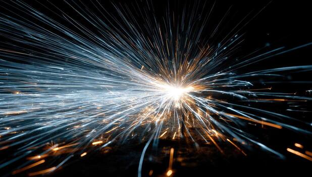 A spark of sparks is shown in the dark photo