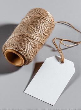 A spool of twine with a white tag on it photo