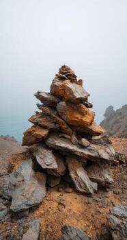 A pile of rocks on the side of a mountain photo