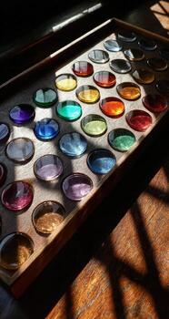 A tray of colored glass on a table photo