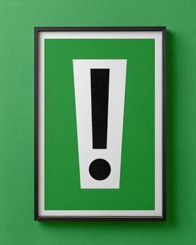 A green and black sign with an exclamation mark photo