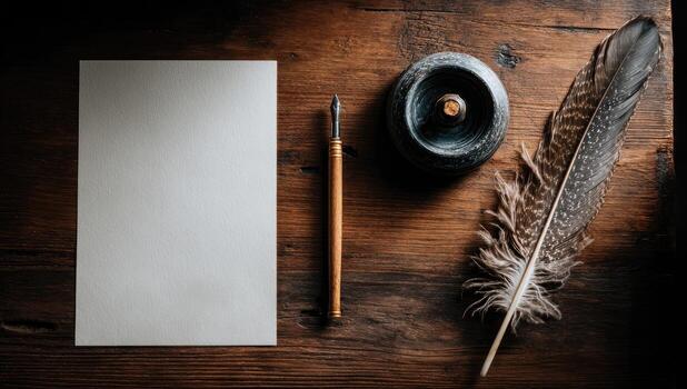 A blank sheet of paper, pen, feather and ink on a wooden table photo
