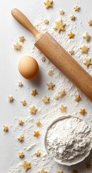 Flour, eggs, and rolling pin on a white background photo