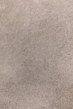 Textured gray surface showcasing intricate patterns and subtle variations in tone, perfect for design projects and backgrounds photo
