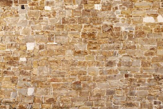 Old brick wall with faded colors, weathered surface, and irregular pattern, offering rustic texture for backgrounds, design, or architectural reference use photo