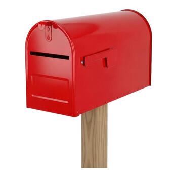 A red mailbox isolated on white background, mounted on a wooden post photo