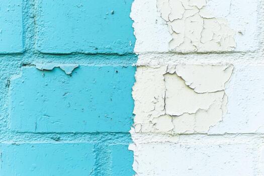 Colored brick wall with peeling paint in a vibrant urban setting photo