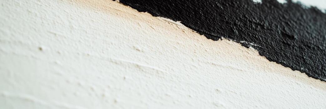 Black and white paint texture on a wall with sharp contrast in colors photo