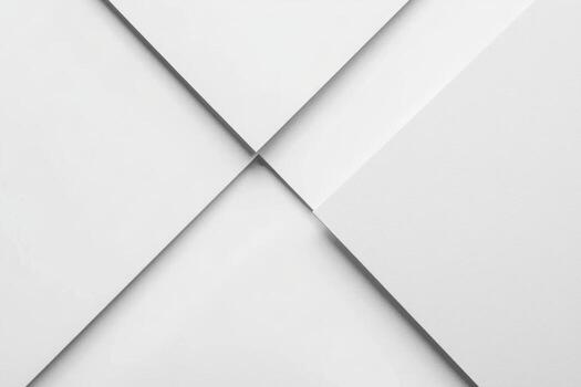 White paper sheets neatly arranged in a cross pattern on a clean surface photo