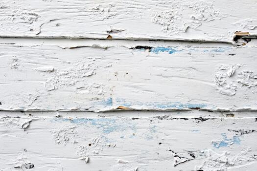 Textured white wooden surface with peeling paint and visible grain patterns photo
