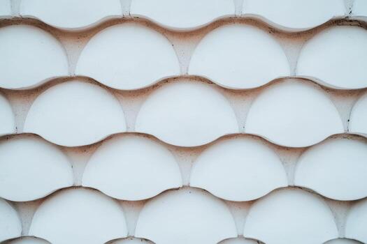 Unique wave pattern of white sculpted wall in modern design setting photo