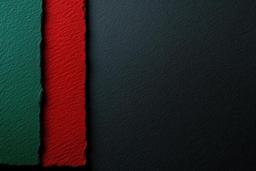 Colorful textured paper pieces in red, green, and dark background display photo