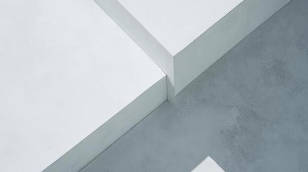 White geometric shapes meet on a smooth gray surface in a modern setting photo