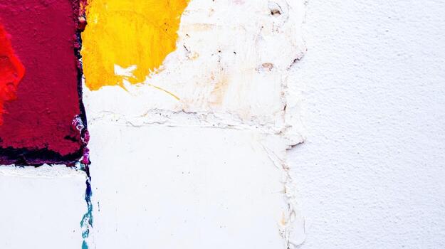 Colorful abstract wall with vibrant paint patches in a urban setting photo