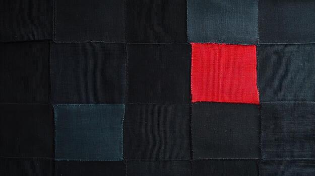 Colorful patchwork fabric showcasing black and red textures in detail photo