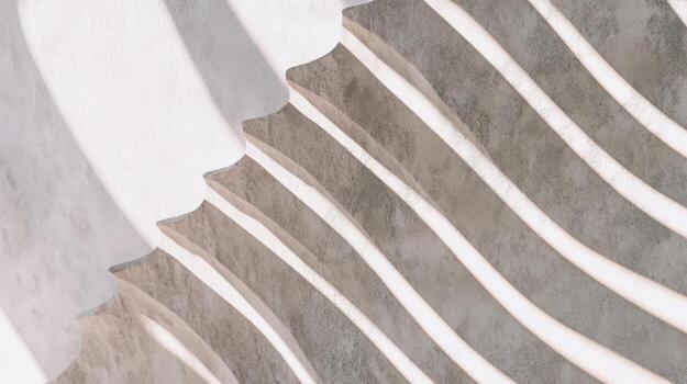 Curved concrete stairs with smooth and textured surfaces in bright light photo