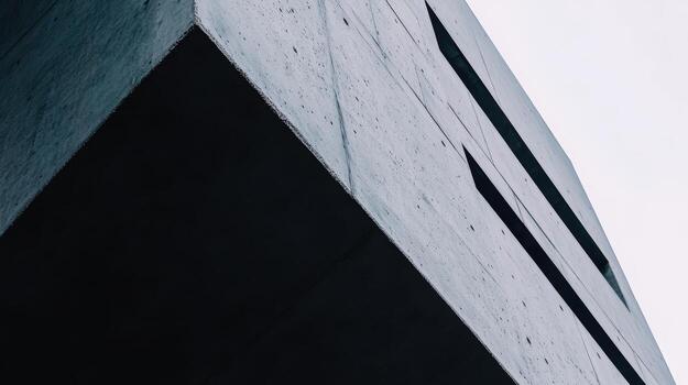 Modern architectural design viewed from below in cloudy atmosphere photo