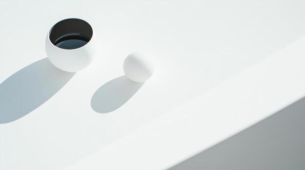 Minimalist composition of white objects with shadows on a smooth surface photo
