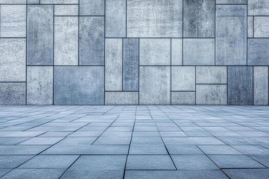 Grey concrete wall with square patterns and tiled floor in urban setting photo