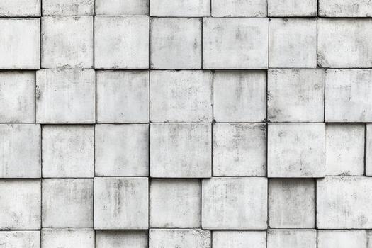 Textured concrete wall with square blocks in a modern setting photo