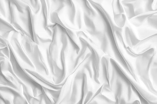 Soft white fabric draped in gentle folds on a smooth surface photo