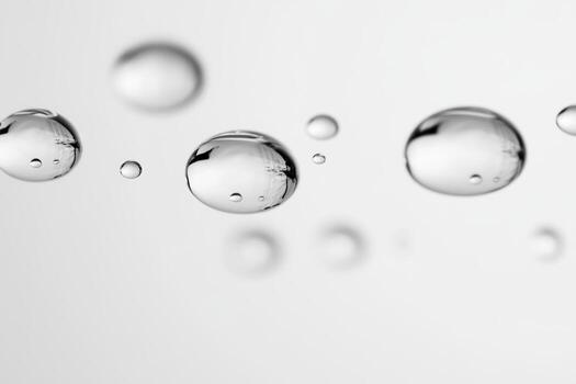Water droplets create a clear, calm effect on a light background photo