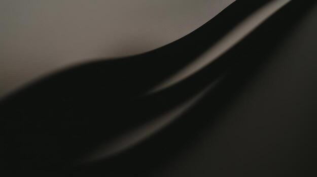 Curved black surface creates a sleek and modern abstract visual effect photo