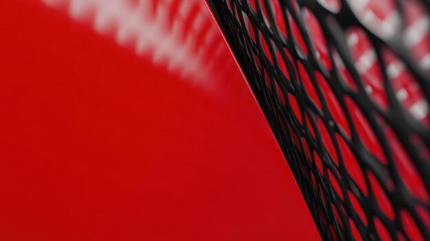 Red background with a black netted texture creating an abstract design photo