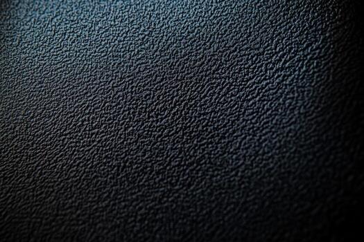Detailed texture of black material showcasing unique patterns and depth photo