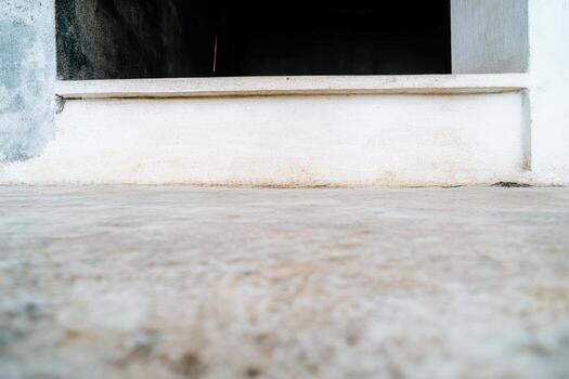 View of a weathered entrance with a focus on the ground in a quiet location photo