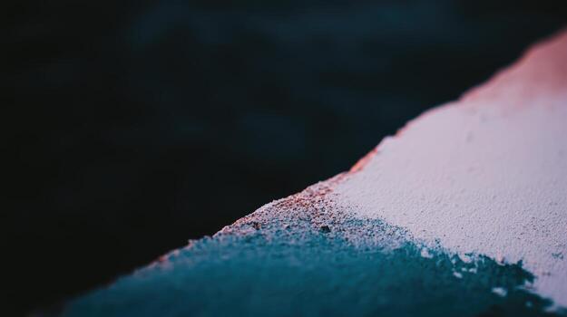 Colorful paint blend on a rough surface in low light setting photo