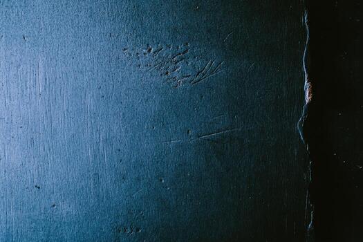 Surface of dark wood with scratches and texture details in low light photo