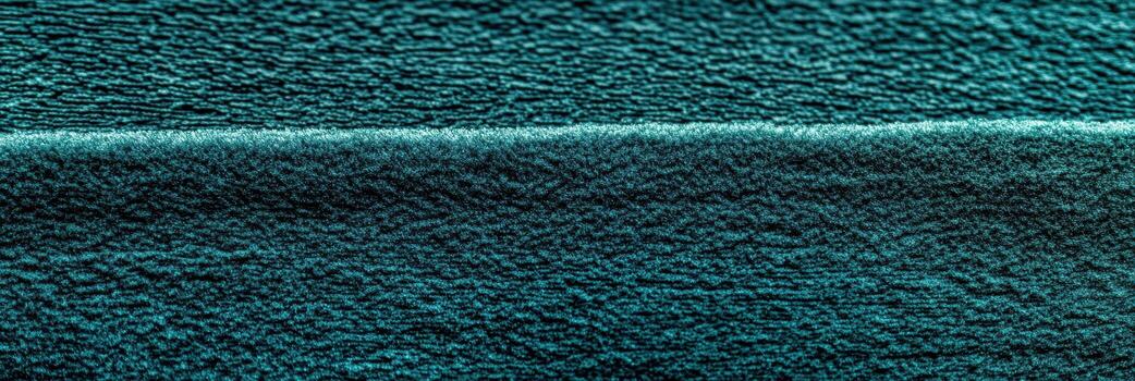 Textured fabric in deep teal color with subtle waves and patterns photo