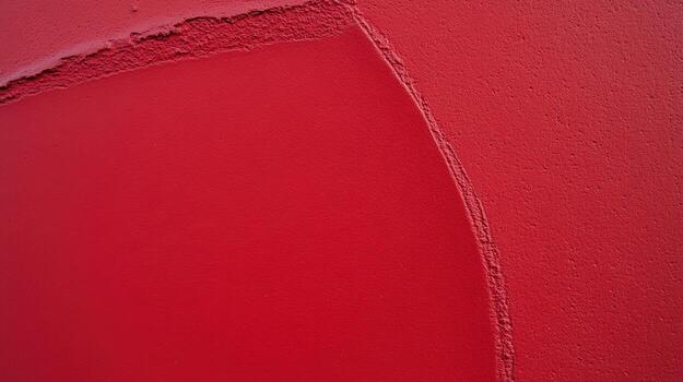 Bright red wall with smooth texture and curved edge in urban setting photo