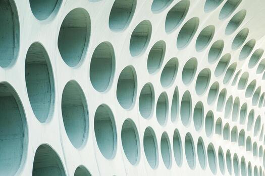 Unique architectural design with circular openings in a modern structure photo