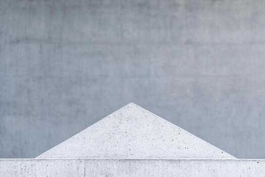Geometric concrete structure against smooth gray wall showcasing minimalism photo